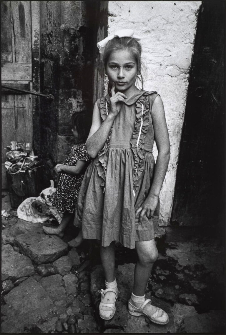 Black and white documentary photography by Mary Ellen Mark. Girl dressed up for Republic Day.