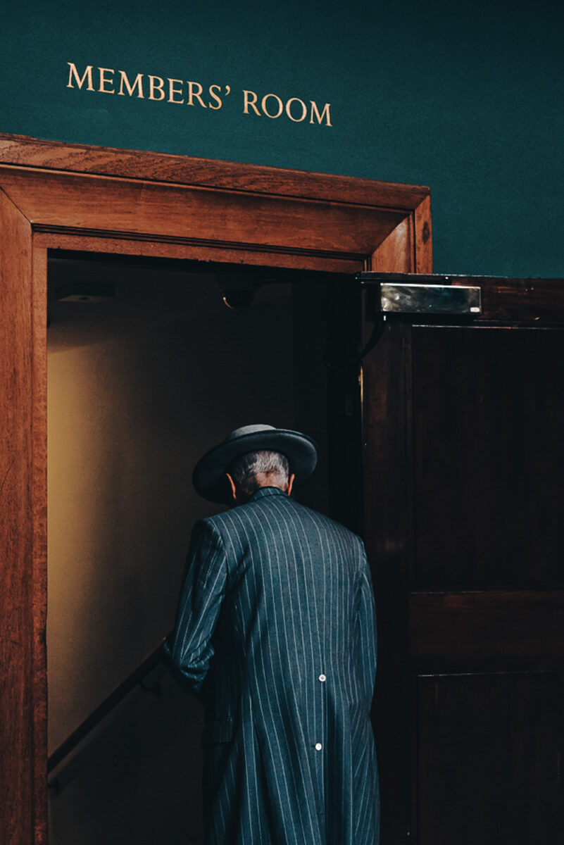 color street photo of a man in pub by Francesco Gioia