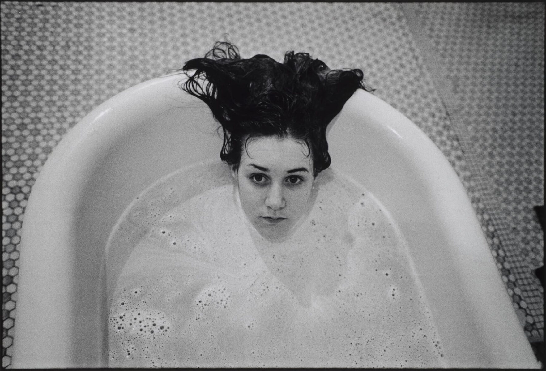 Black and white photography by Mary Ellen mark, woman in bathtub, at Oregon state hospital