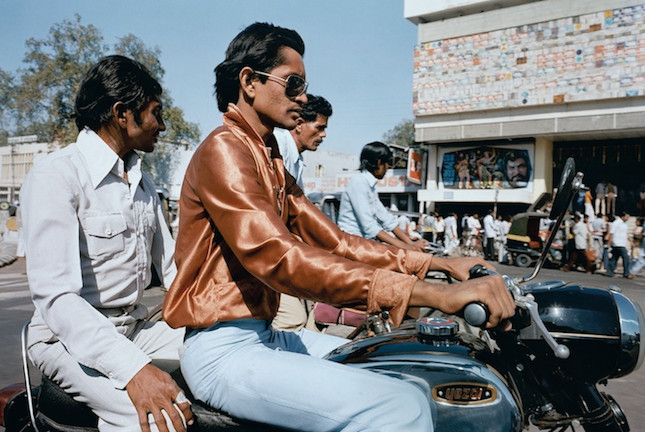 Color photography by Mitch Epstein, Ahmedabad, Gujurat 1981, men riding motorbike from the Steidl book, In India