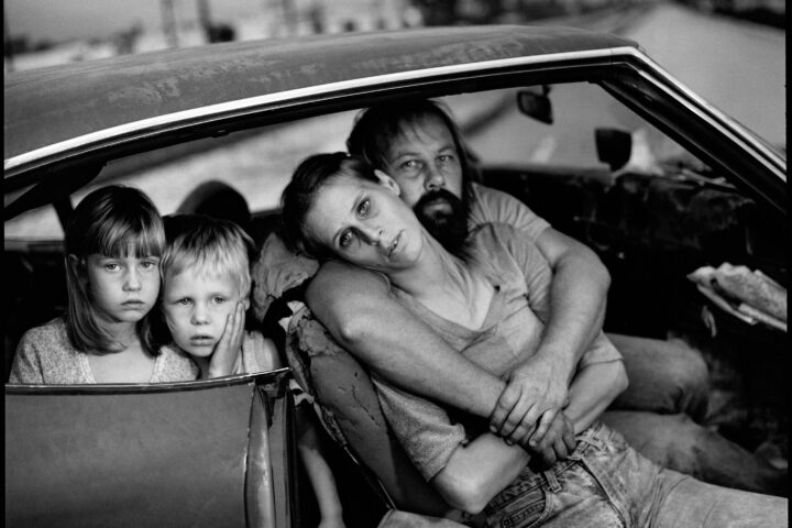 Black and white documentary photography by Mary Ellen Mark. Family in their car