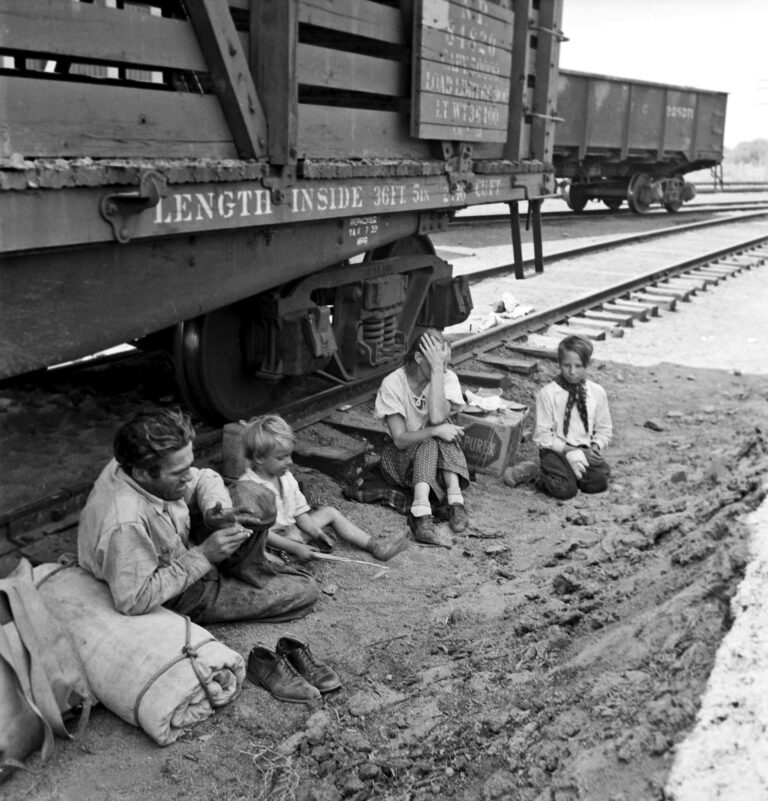 Black and white photography by Dorothea Lange. Family who traveled by freight train Yakima valley, 1939