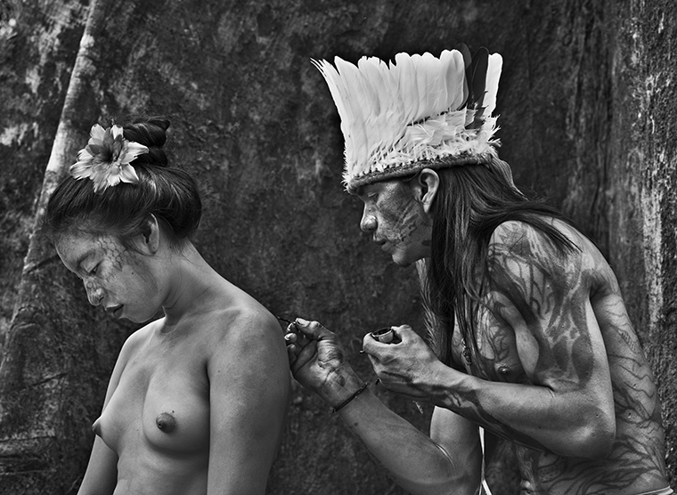 black and white photo of a man and woman from the Amazonian by Sebastião Salgado