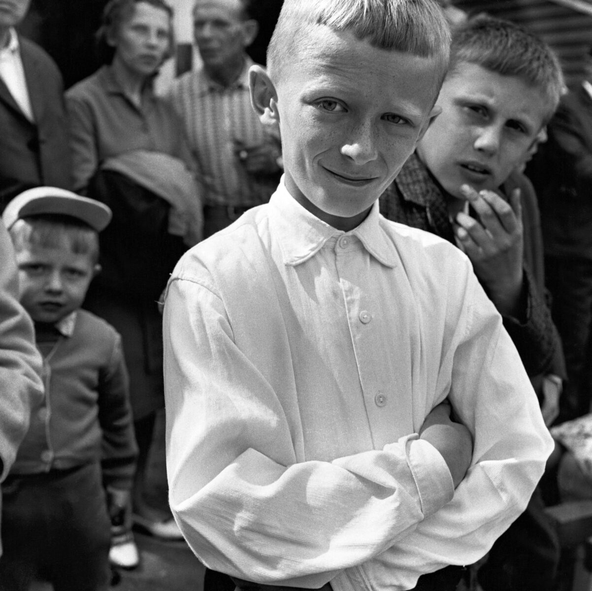 Black & white photography by Antanas Sutkus. young boys at a festival in Kulautuva, 1965.