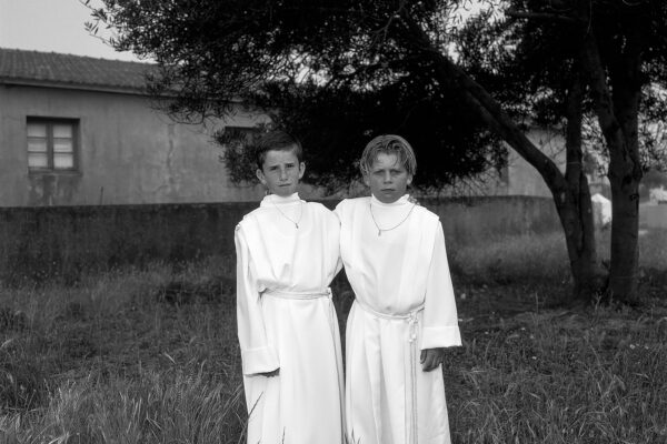 black and white film portrait of two boys on the day of their First Communion in Portugal by Candy Lopesino