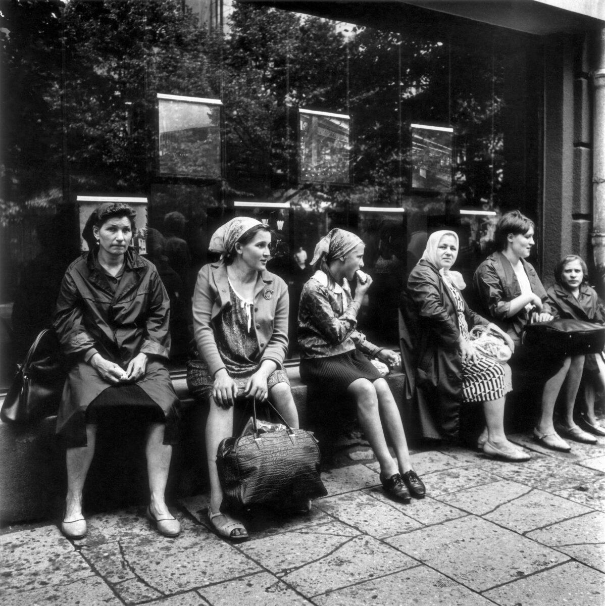 Black & white photography by Antanas Sutkus, women after shopping, Vilnius, 1971. From Planet Lithuania