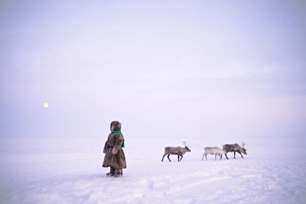 Color photo of a young nomadic reindeer herder in Yamal peninsula, Siberia, Northern Russia by Nicola Ducati