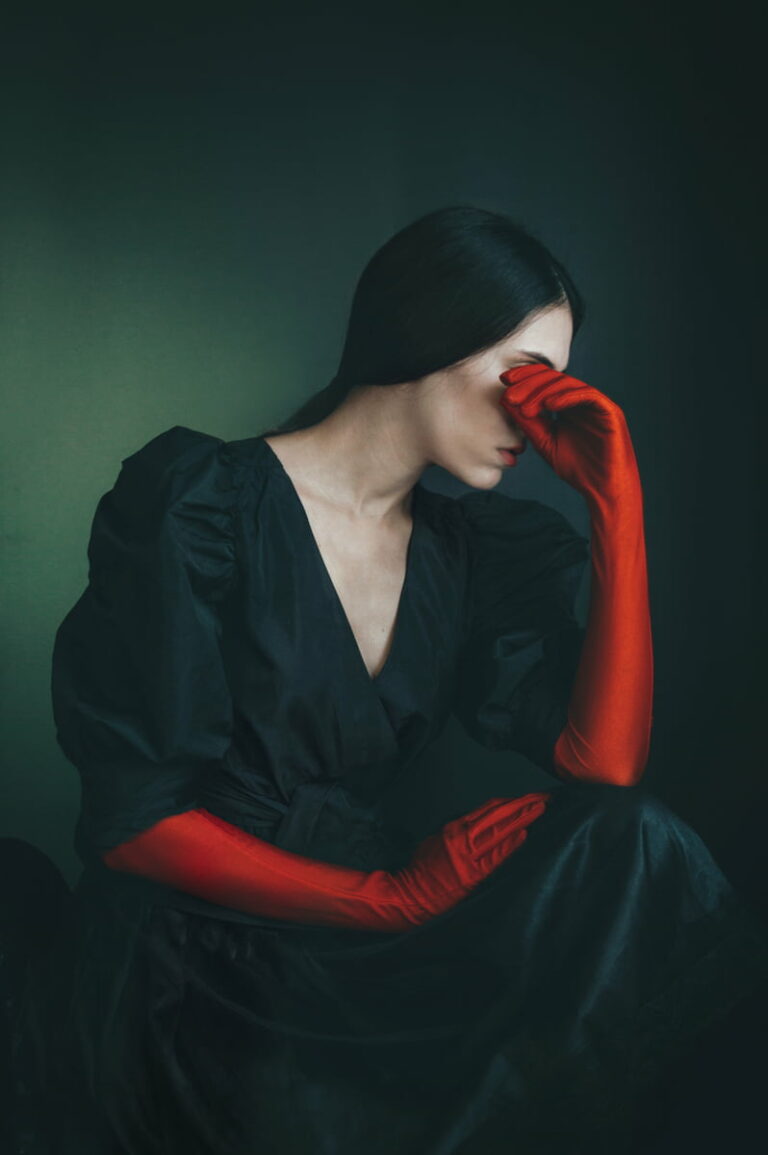 Color photography portrait of woman with red gloves by Anna Karvounari