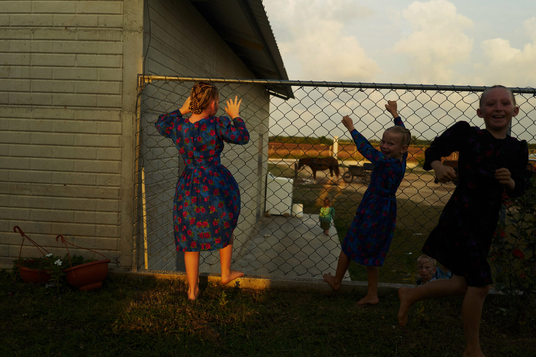 Color film photo by Jake Michaels, Mennonite girls playing, from the book c.1950