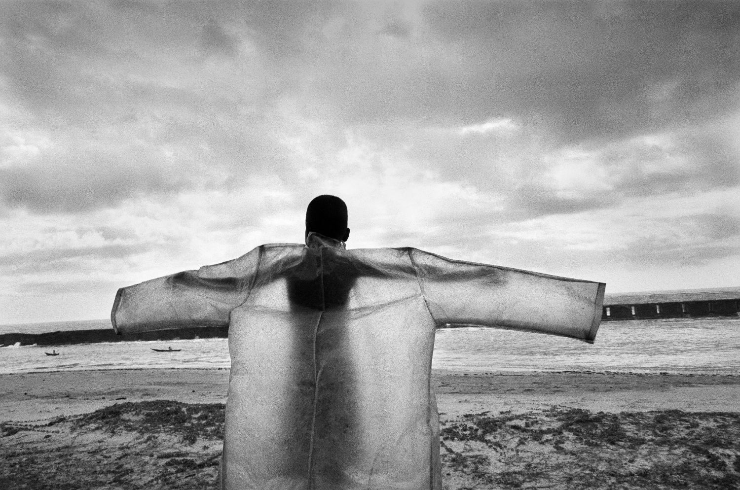 Black and white photography by Pierrot Men, boy on the beach in Madagascar