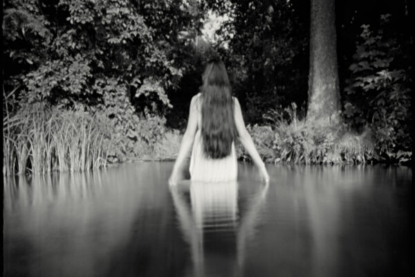 black and white film photo of a woman in water by Joanna Borowiec