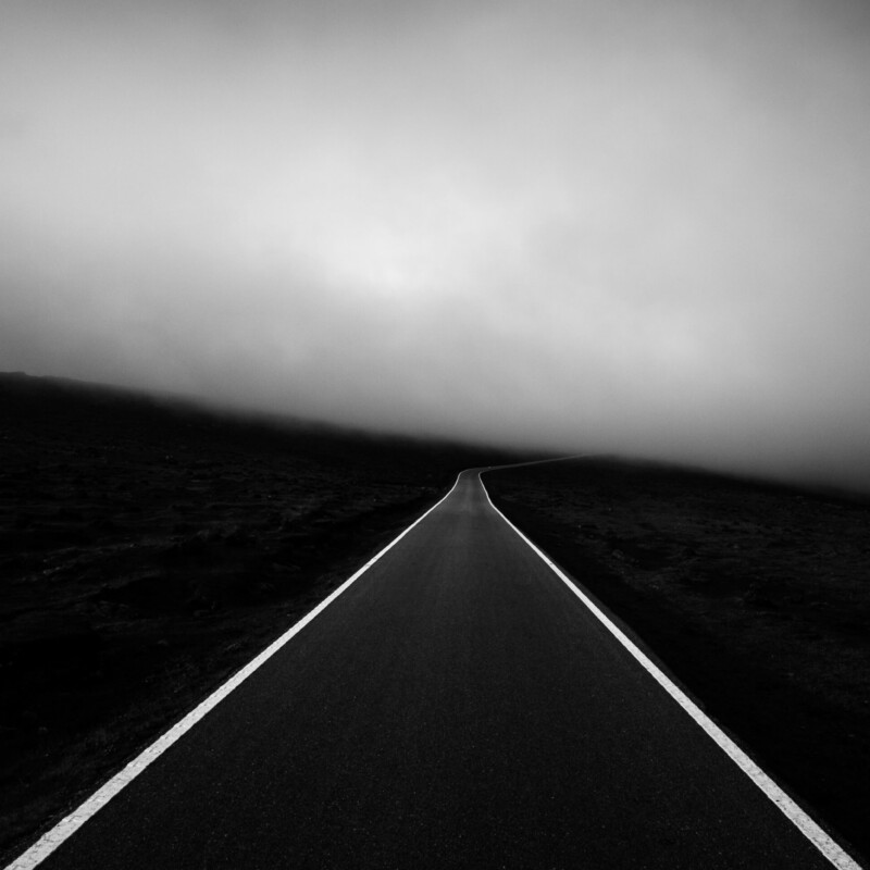 black and white landscape film photo of a road by Alexandre Caetano