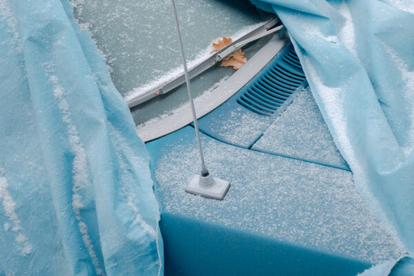 Color photography by Zoë Waldman, blue car and tarp, from Unfolding into Morning.