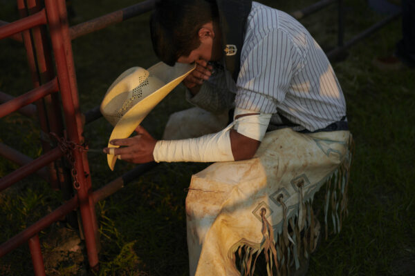 Jack Sorokin Rodeo Boys, documentary photography of boy praying at rodeo