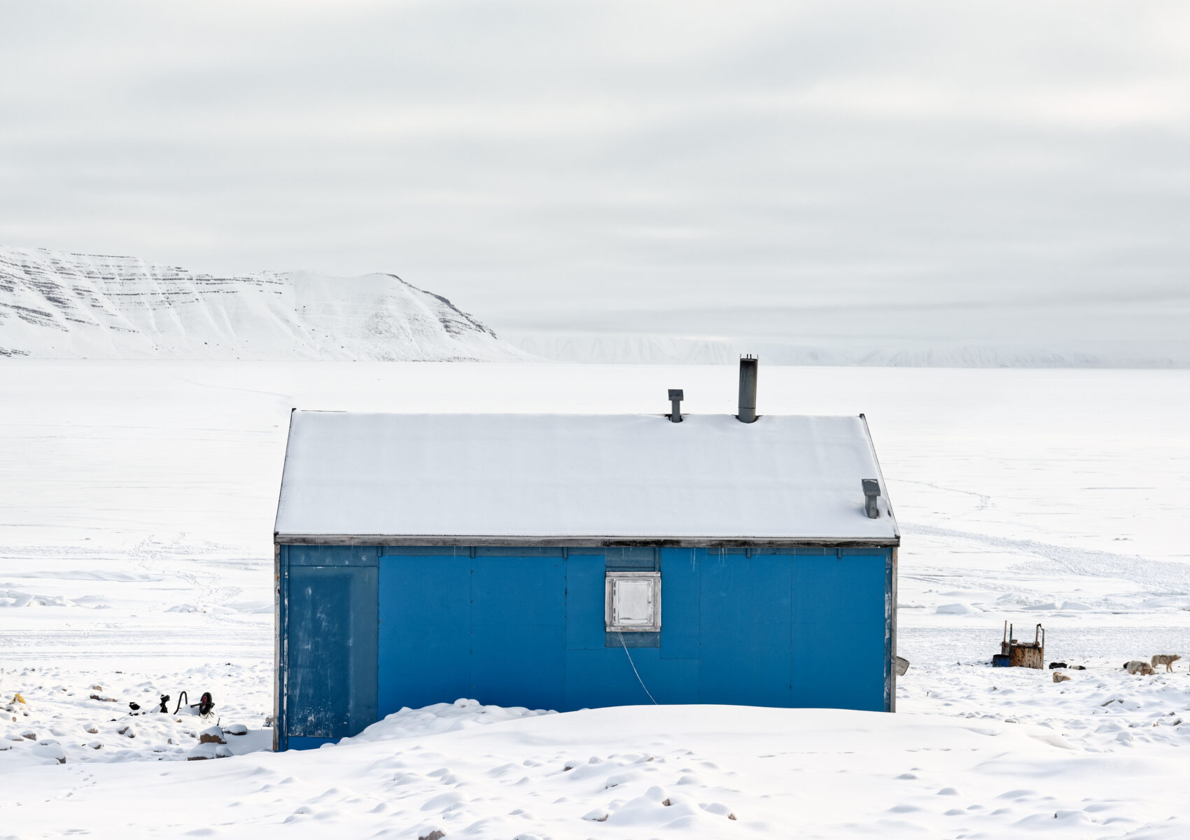 color photography by Tiina Itkonen, blue house in the snow