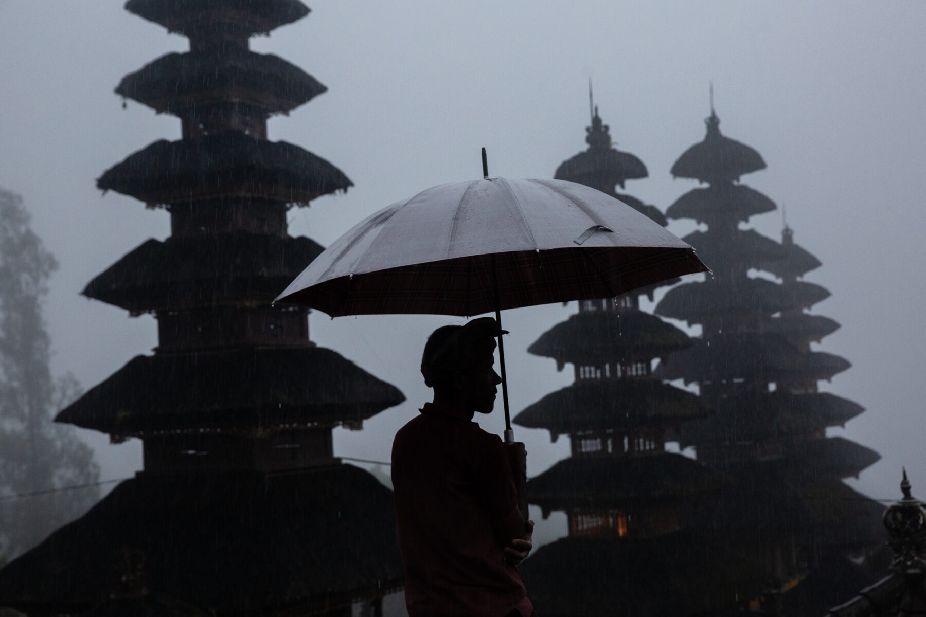 Color photography by Michael Dean Morgan, temples, rain, umbrella, Bali