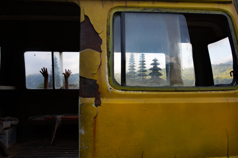 Color photography by Michael Dean Morgan, hands, yellow van, temple, Bali