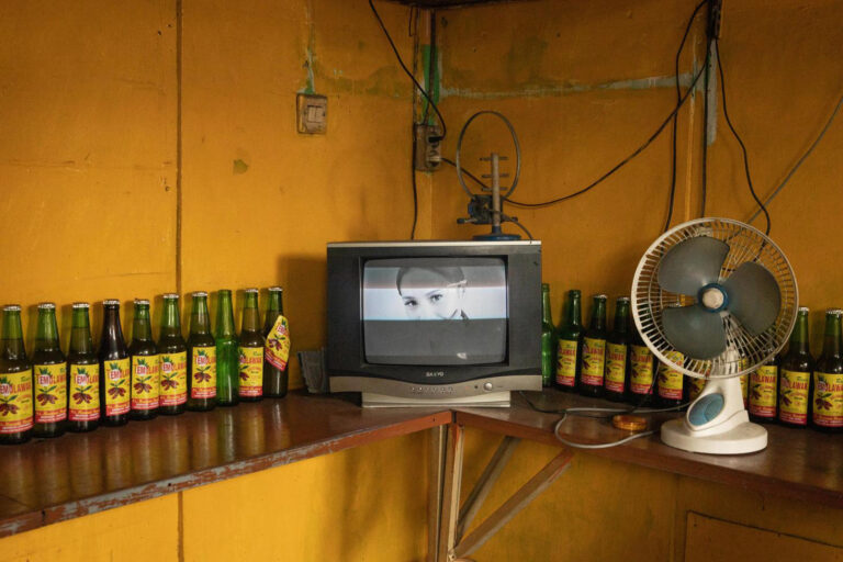 Color photography by Michael Dean Morgan, tv, beers, yellow room Bali