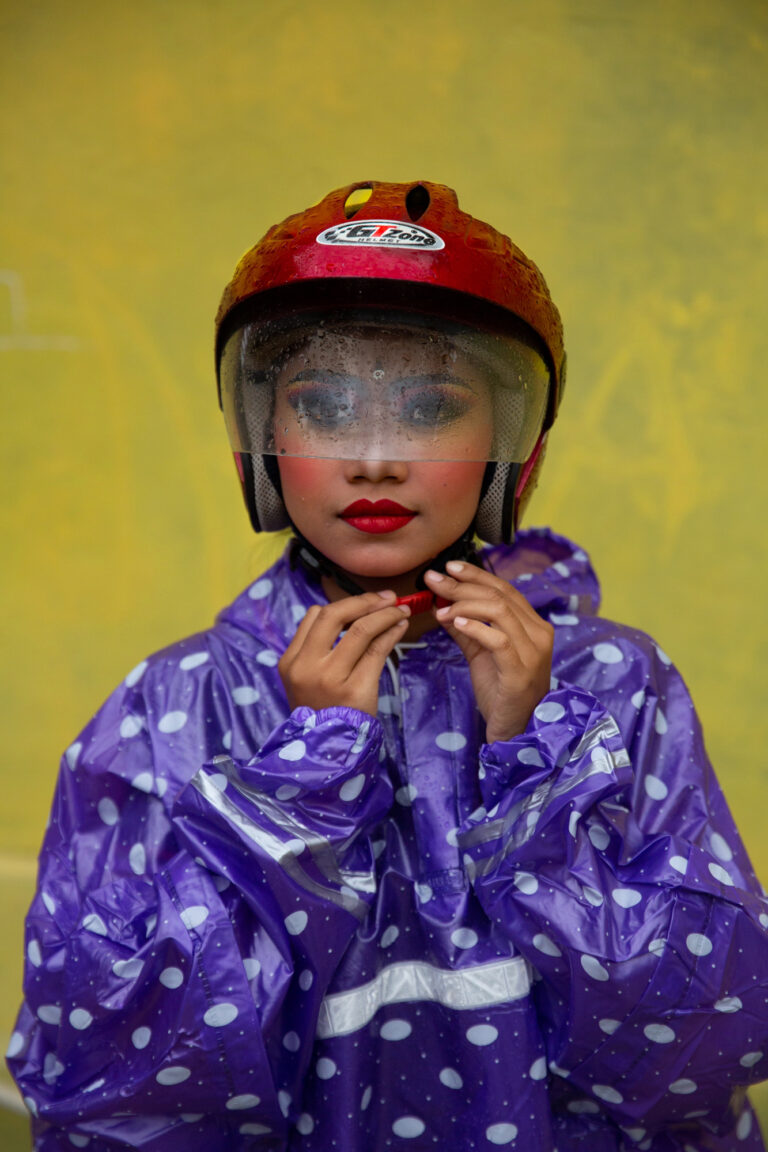 Color photography by Michael Dean Morgan, woman in motorbike helmet, Bali