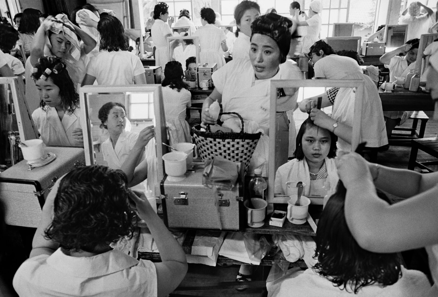 Black & white street photography by William Klein, Hairdresser’s School, Tokyo, 1961