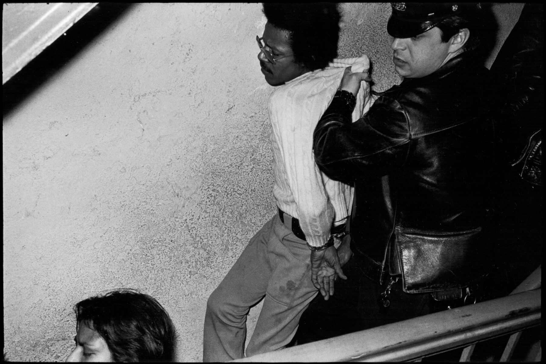 Cop Dragging Out Perp, NYC, street photography by Jill Freedman