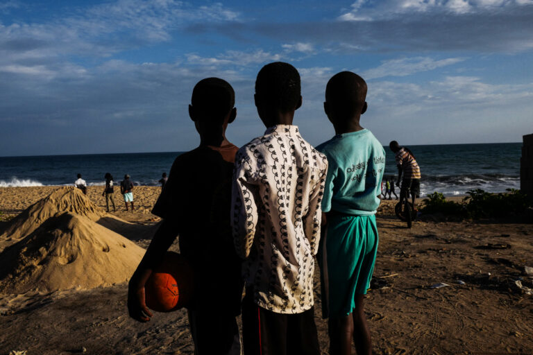 Color street photography by Andrea Torrei, boys, beach, Ghana