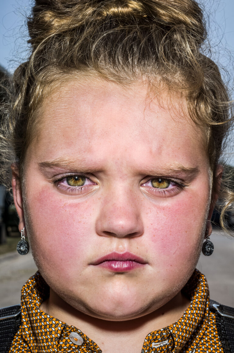 Color portrait by Bruce Gilden, farm girl, Iowa