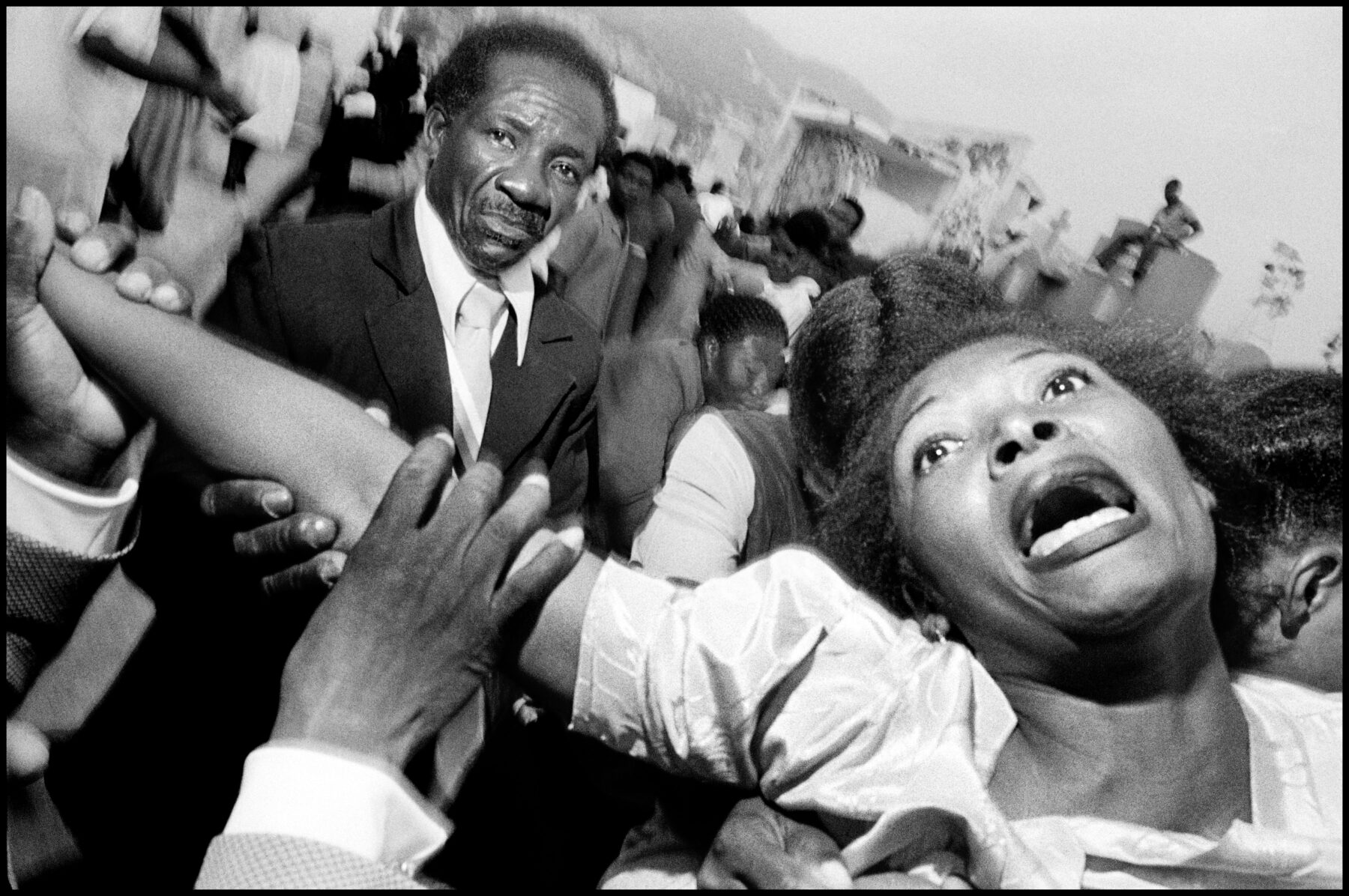 Black and white street photography by Bruce Gilden, funeral, Haiti