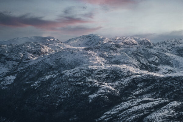 color landscape photograph of mountains in Preikestolen, Norway by Samuel Hardwick