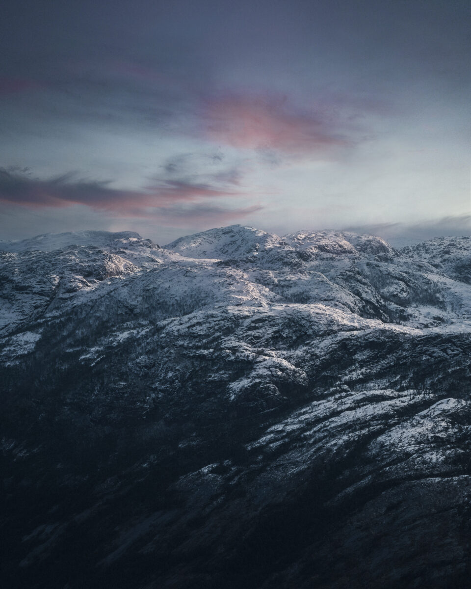 color landscape photograph of mountains in Preikestolen, Norway by Samuel Hardwick