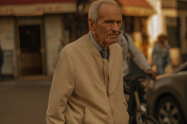 color street photo of a man walking in Paris, France by Andreea Badiu-Slabu