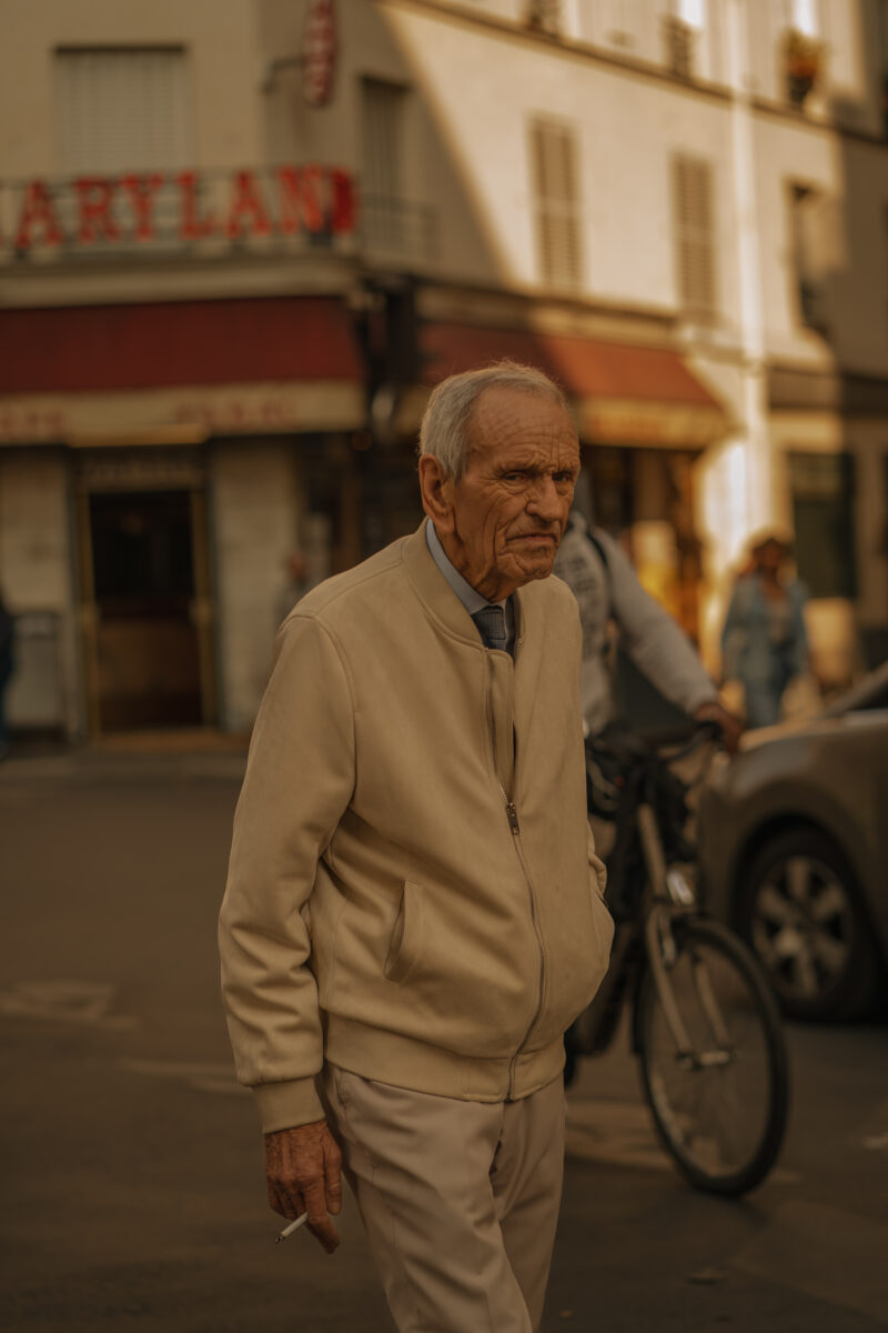 color street photo of a man walking in Paris, France by Andreea Badiu-Slabu