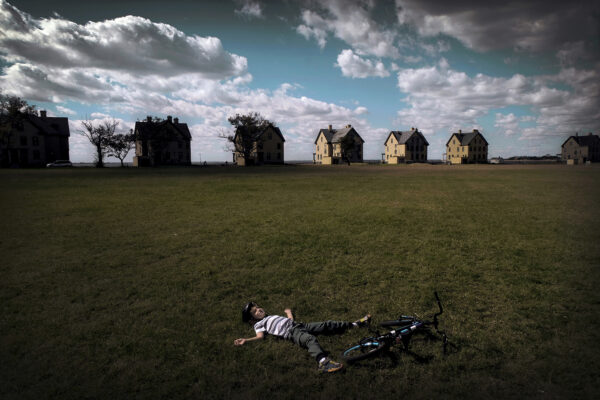 color street photo of a kid and houses by Brad Jones