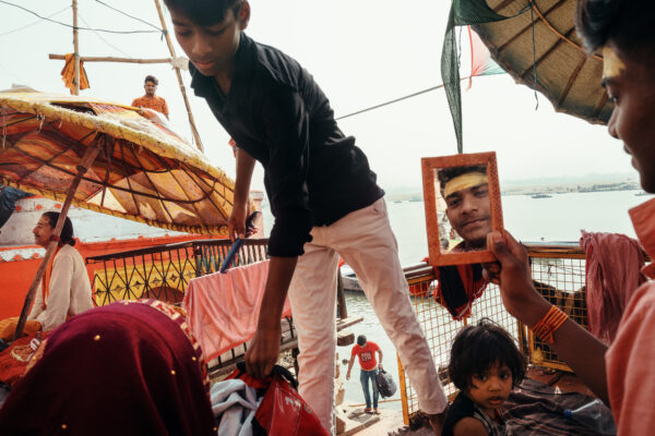 color street photo of people in Varanasi, India by Jonathan Jasberg