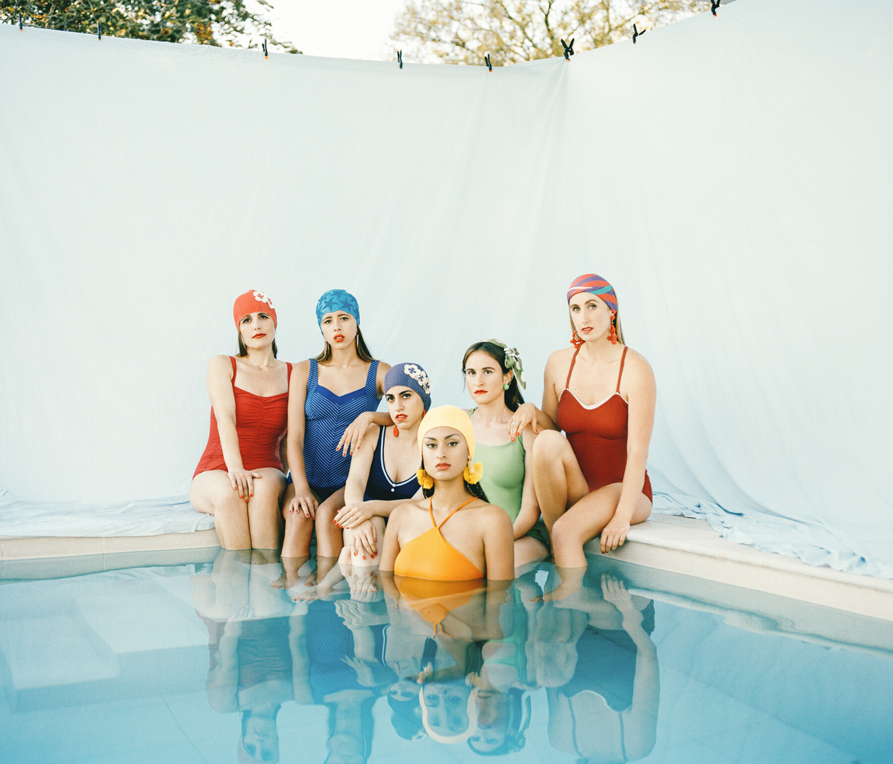 color film photo of women in colourful bathing suits by Vikram Kushwah