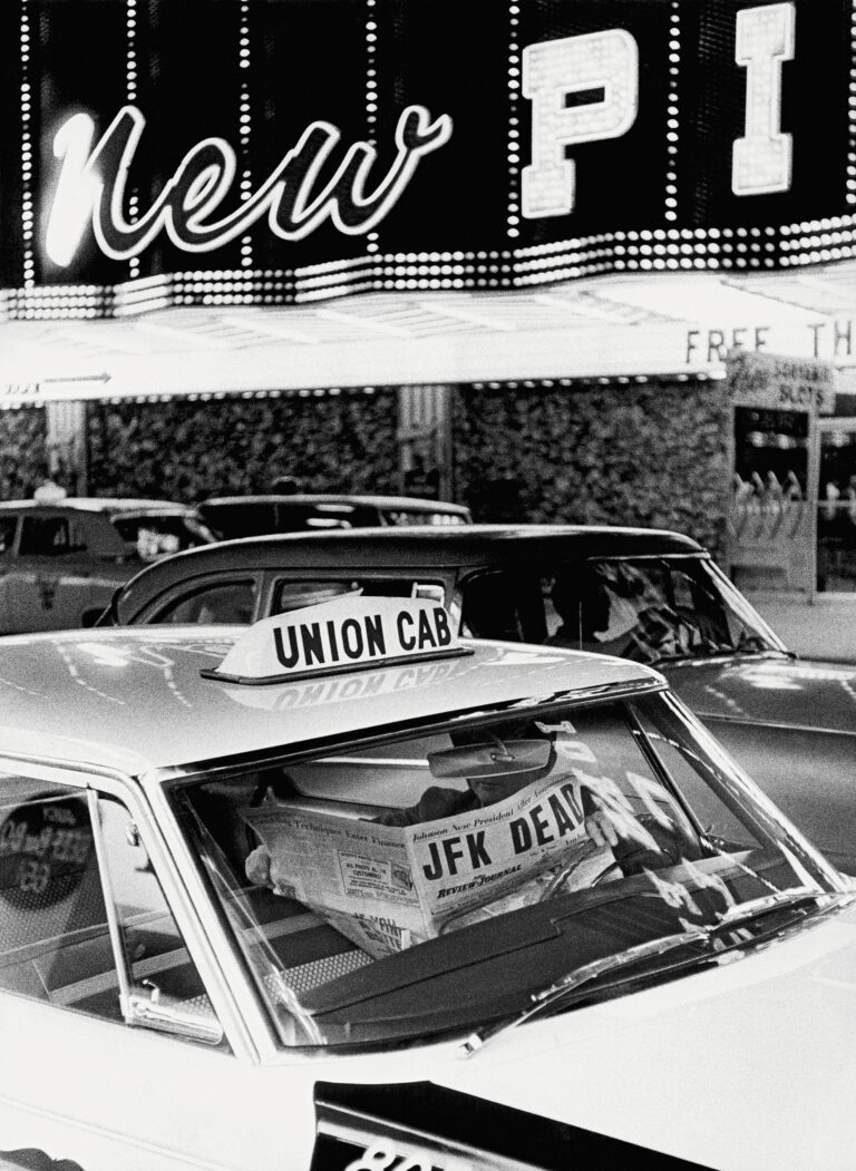 Thomas Hoepker, black & white photography, Las Vegas 1963. Taxi driver with newspaper announcing the assasination of JFK.