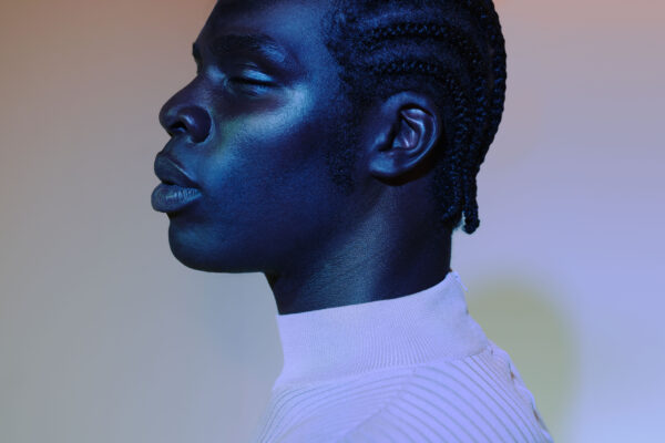 color studio portrait of a black model by Carly Zavala