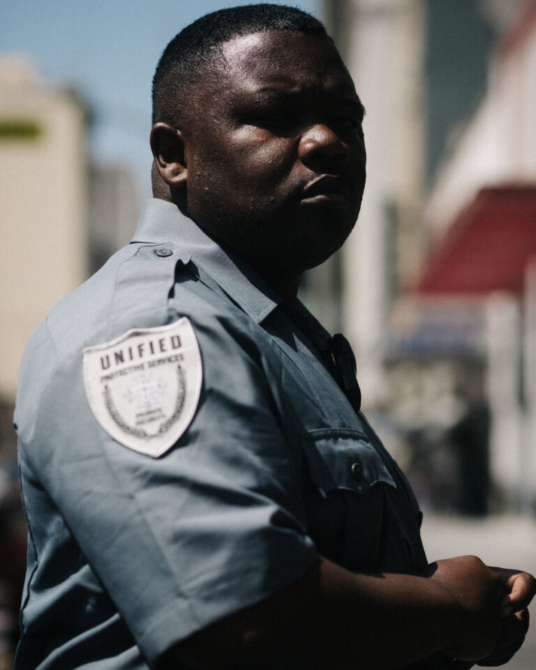 Street photography by Young Chul Kim, portrait of cop, policeman, NYC, from the book Feeling Before Seeing