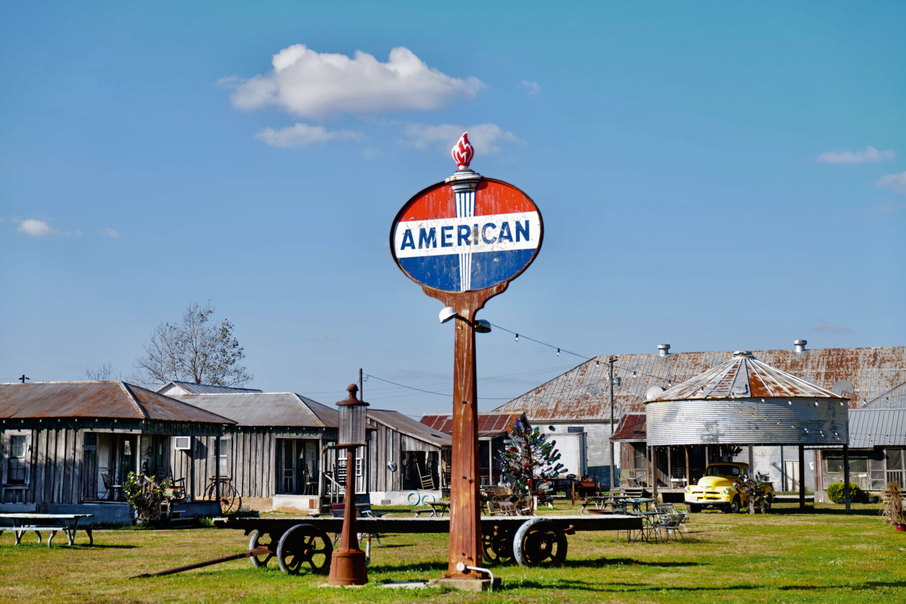 Color photography by Thomas Hoepker, rusty metal buildings and sign. From, The Way it was. Road Trips USA