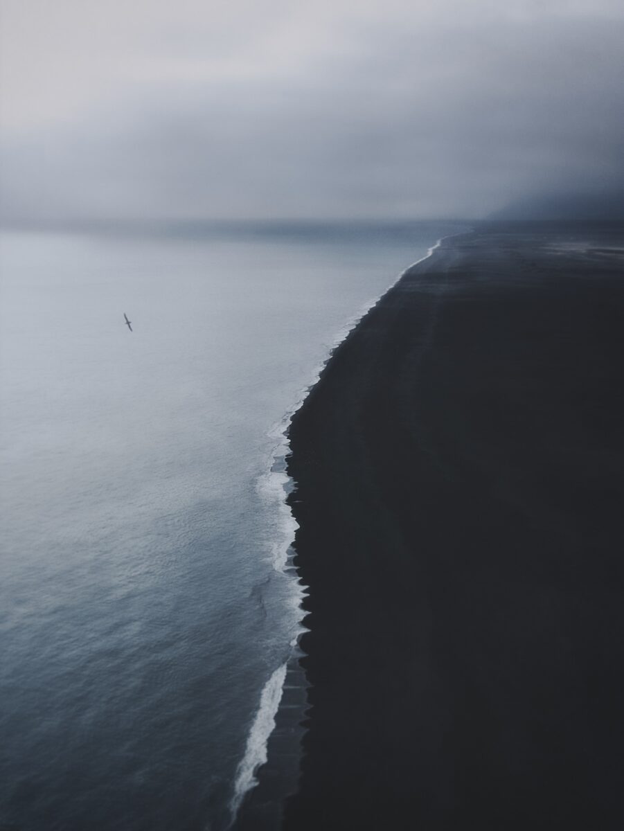 Aerial landscape photography by Thaddäus Biberauer​​, coastline, black sand, Iceland.