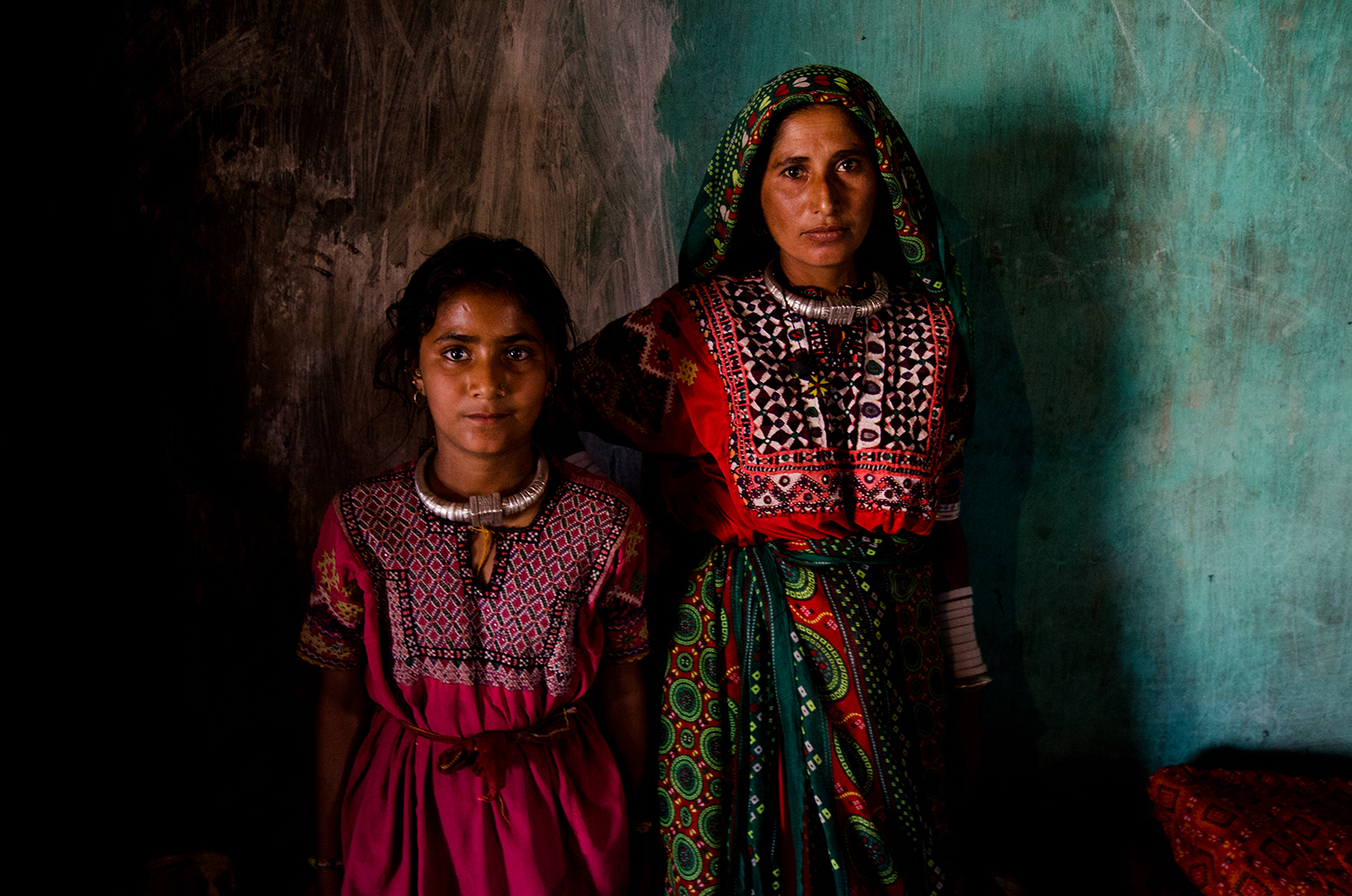 color portrait photo of a girl and a woman in India by Robi Chakraborty