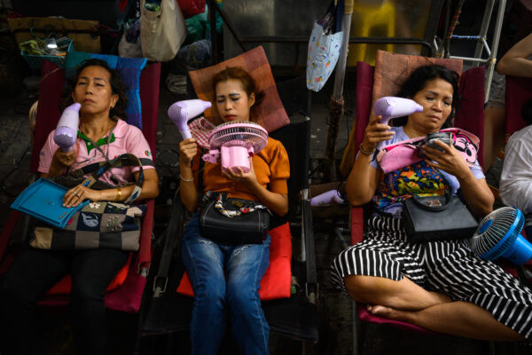 color street photo of women in Bangkok, Thailand by David Keith Brown