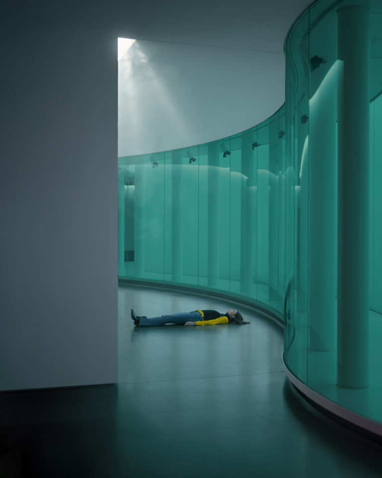 Color photography by Paolo Baretta. Portrait of woman lying on floor in corridor