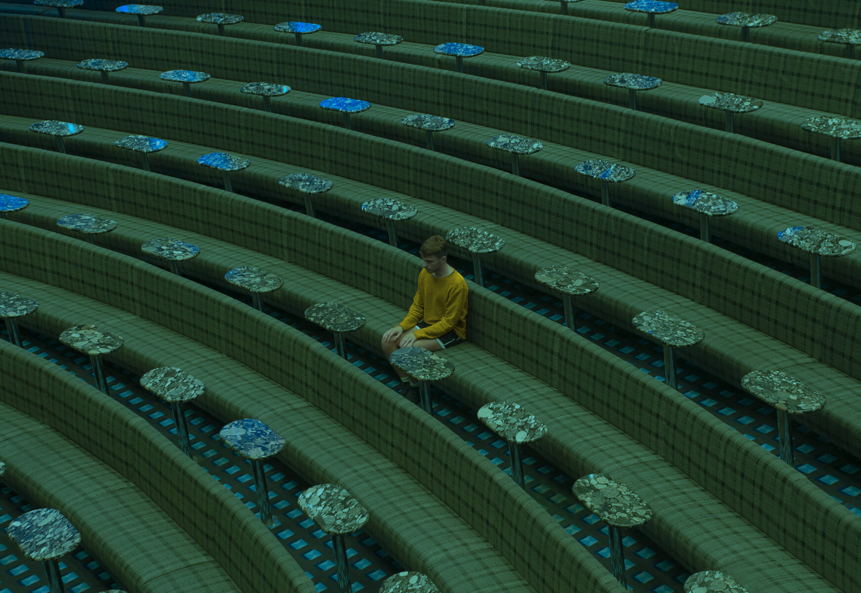 Color photography by Paolo Baretta. Portrait of man in green room, seating