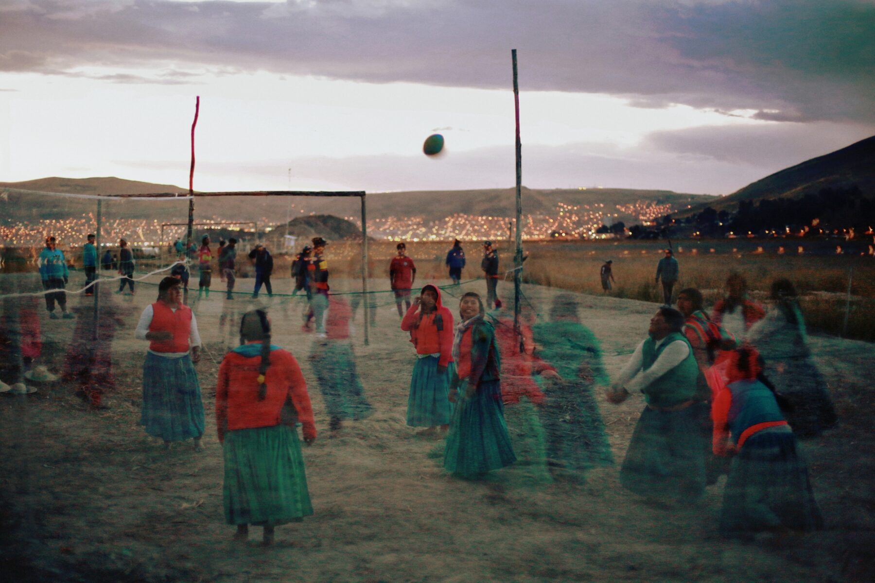 color photo of Women playing volleyball on the Titicaca Lake in Peru by Felicia Simion