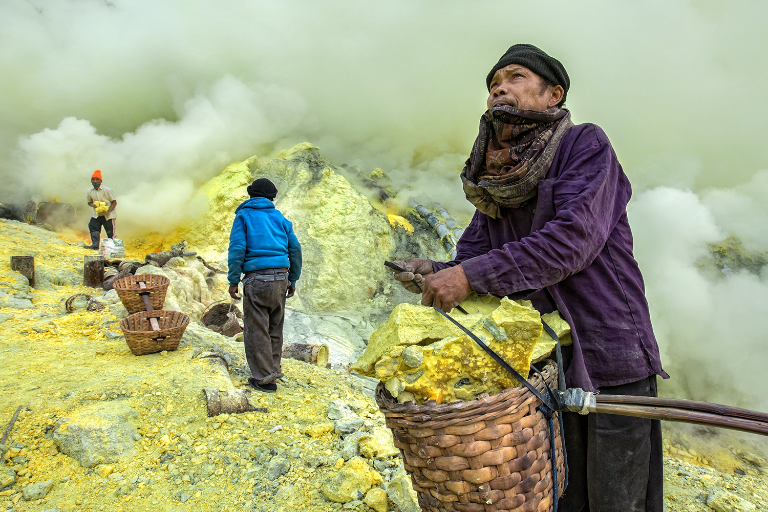 color photo of men extracting sulfur in Indonesia byGiulio Montini