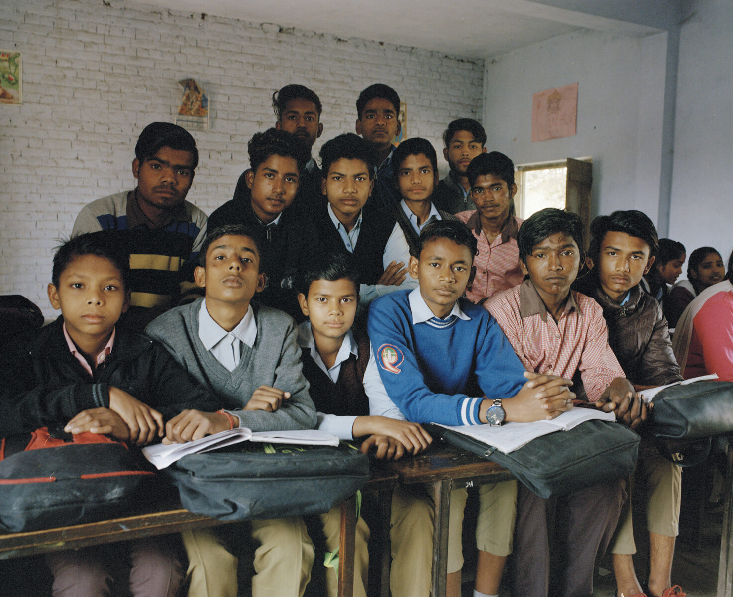 Group portrait of boys in classroom, india, by Vikram Kushwah