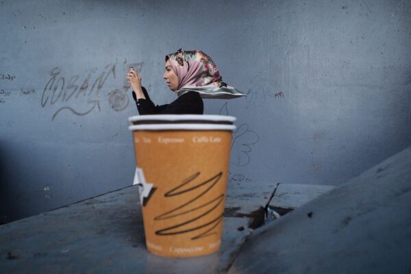 color street photo of woman in Istanbul, Turkey by Gokhan Arer