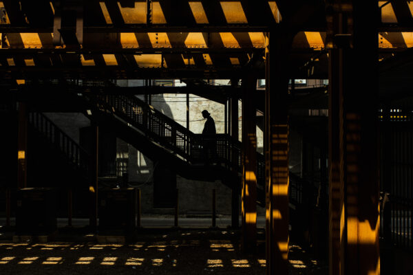 color street photo of a man in subway in Chicago, USA by John Yuhas