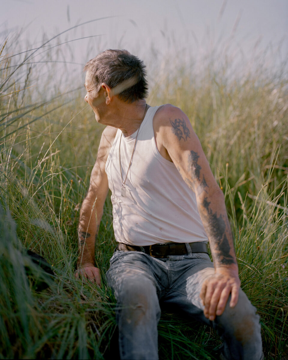 Max Miechowski portrait photography, tattooed man looking out to sea